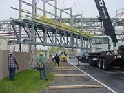 Crane rigs bridge into position